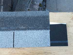 Starter shingle roll next to roof shingle